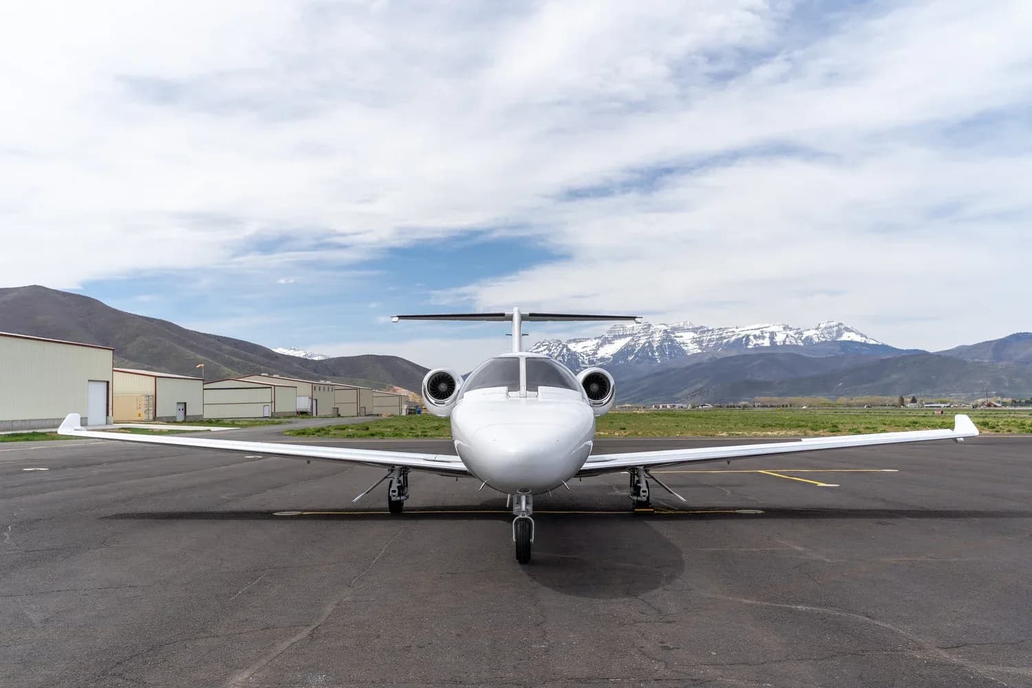 Front view of Cessna Citation CJ3+ aircraft N1099 on the tarmac.