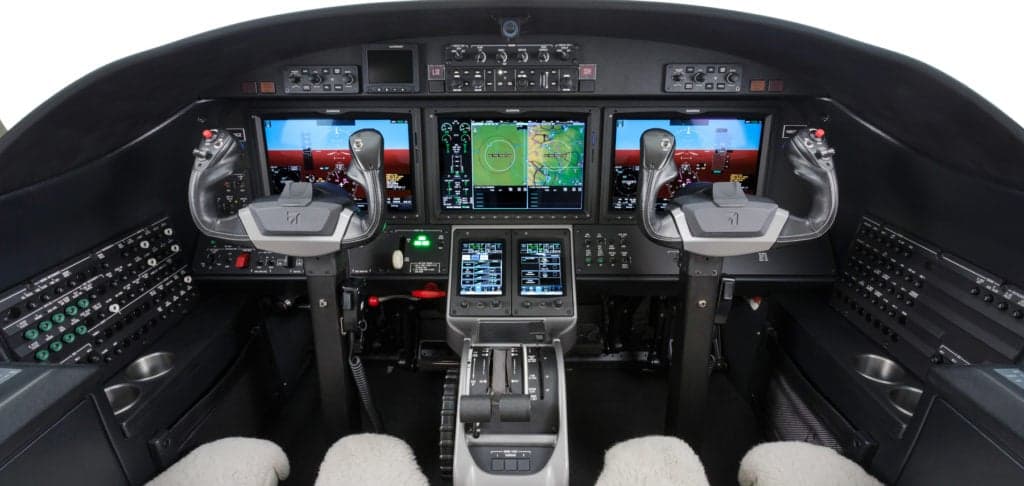 The cockpit of a Citation M2 aircraft with modern avionics.