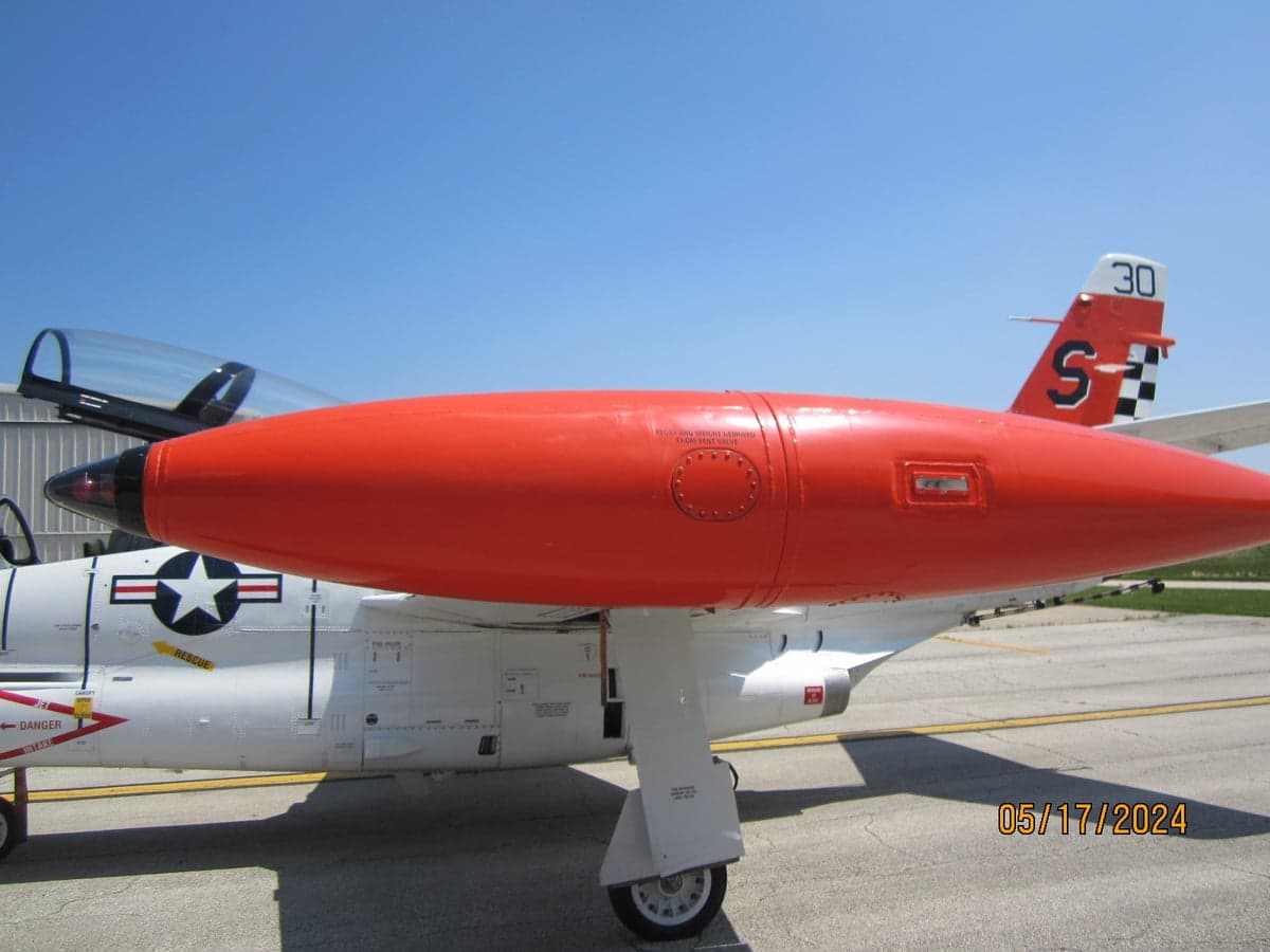 Side view of the T-2B Buckeye aircraft showing the fuselage and wing root.