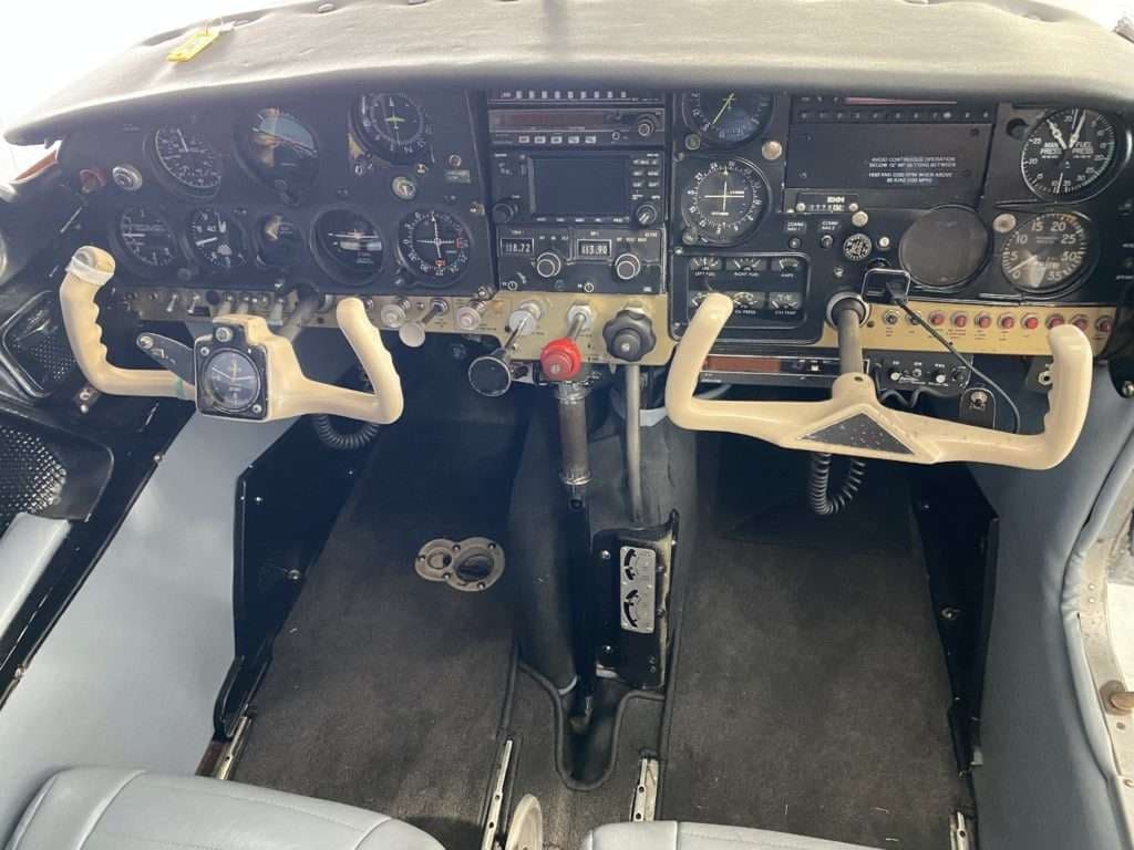 The instrument panel and yokes of the Mooney M20C aircraft.