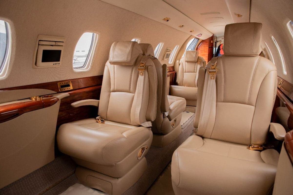 View of the leather seats in the aircraft cabin.