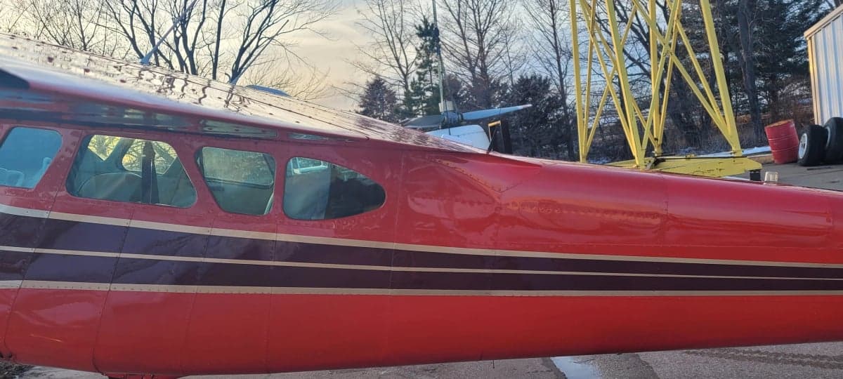 Side view of the Cessna 195 fuselage, showing the windows and paint scheme.