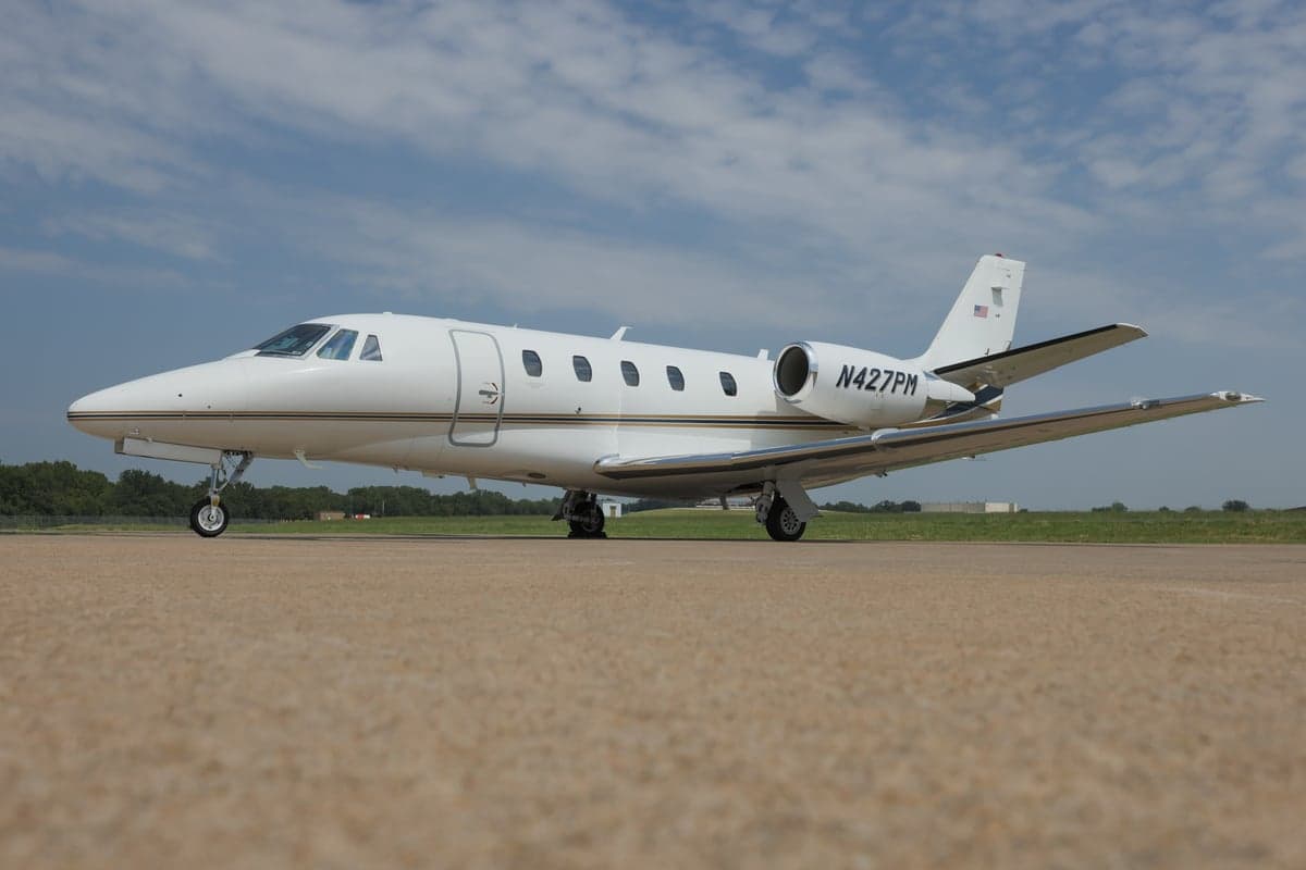 A Citation XLS+ aircraft with registration N427PM is parked on the tarmac.