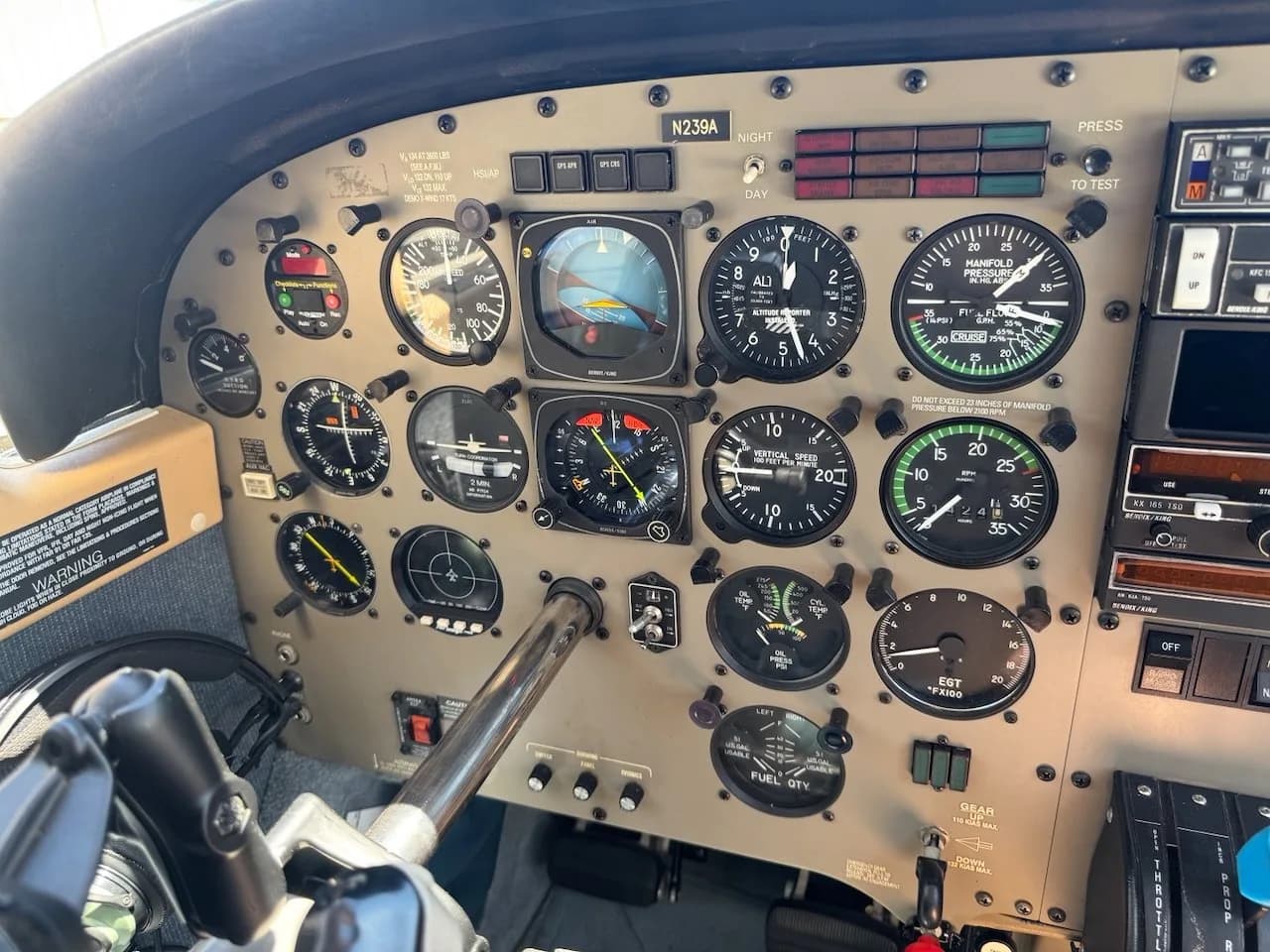 A close-up view of the pilot's side instrument panel in an aircraft cockpit, showing various gauges and controls.