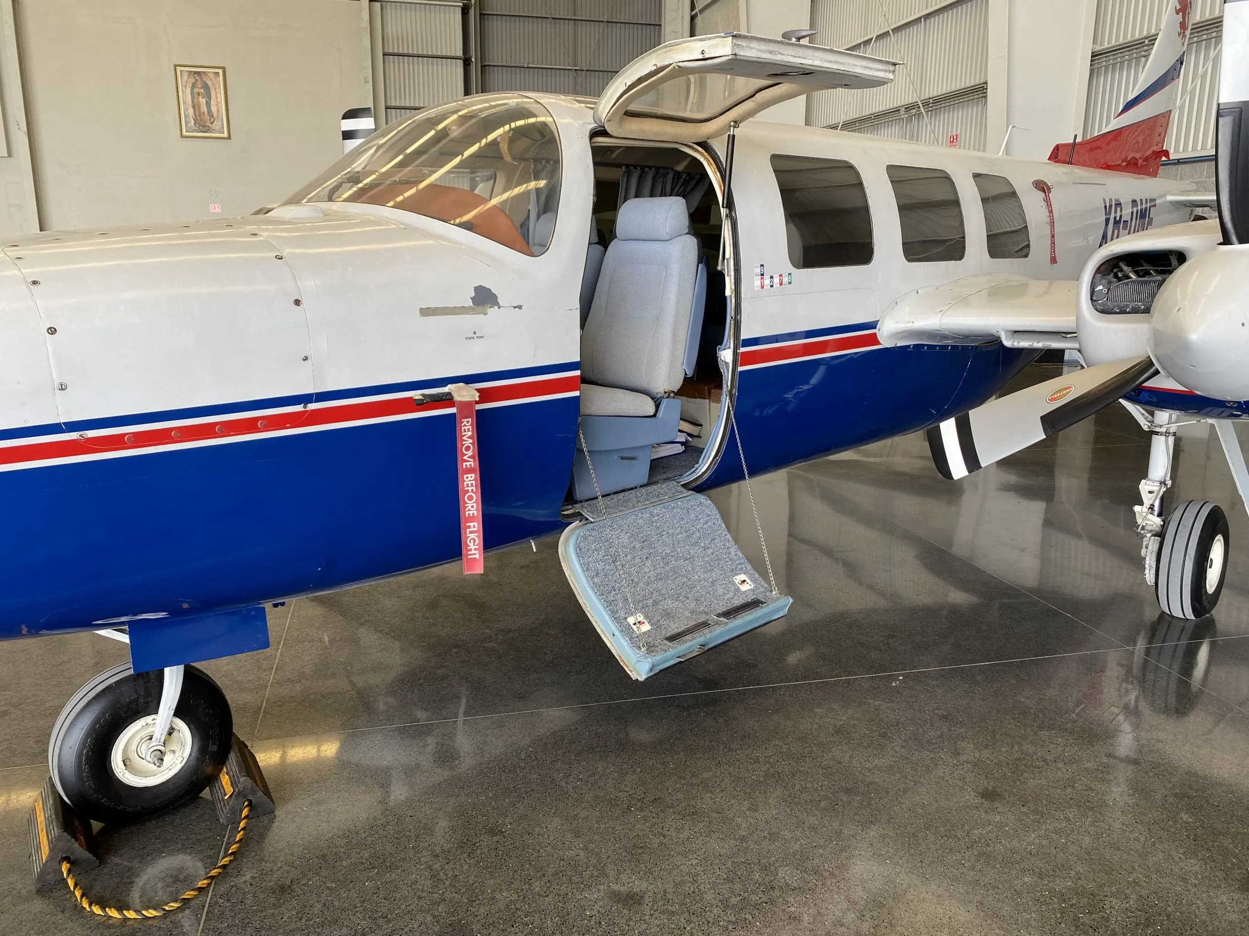 Close up of the XB-DMF aircraft with the door open and the step extended.
