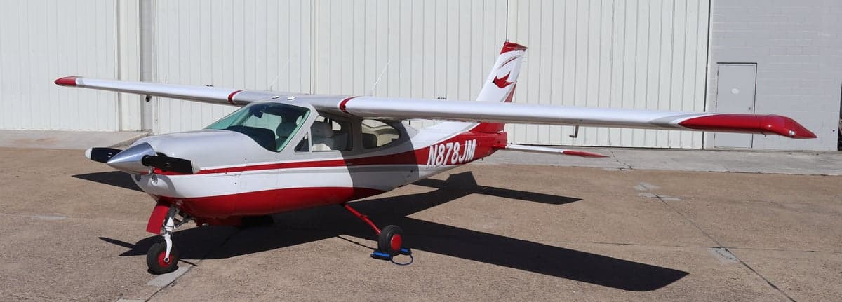 Front three-quarter view of the Cessna N878JM on the ground.