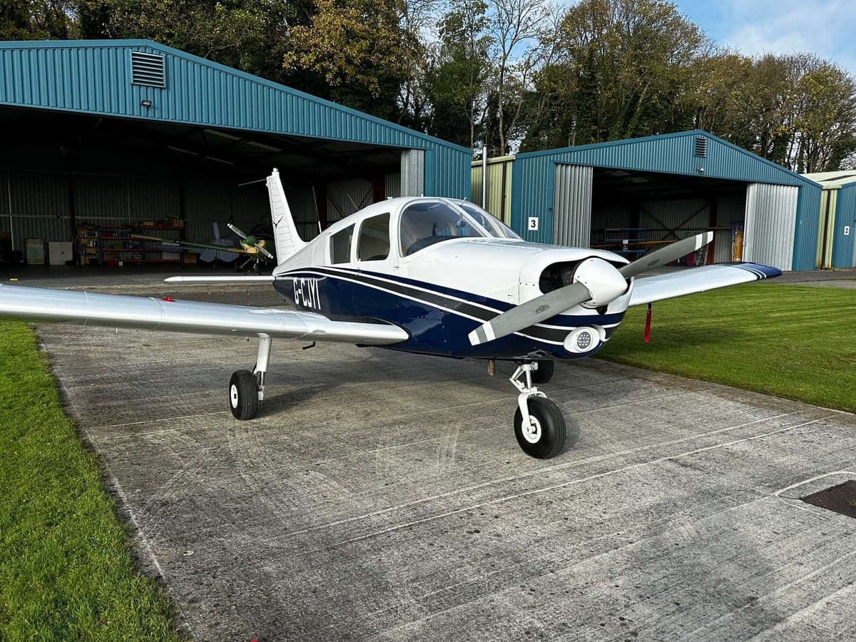 Piper PA-28-161 Warrior II aircraft parked on the tarmac.