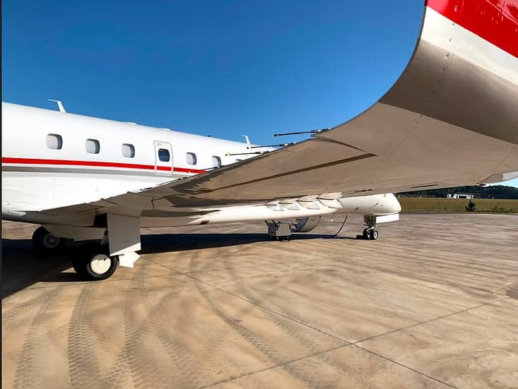 Underside of the wing of the Embraer Legacy aircraft.