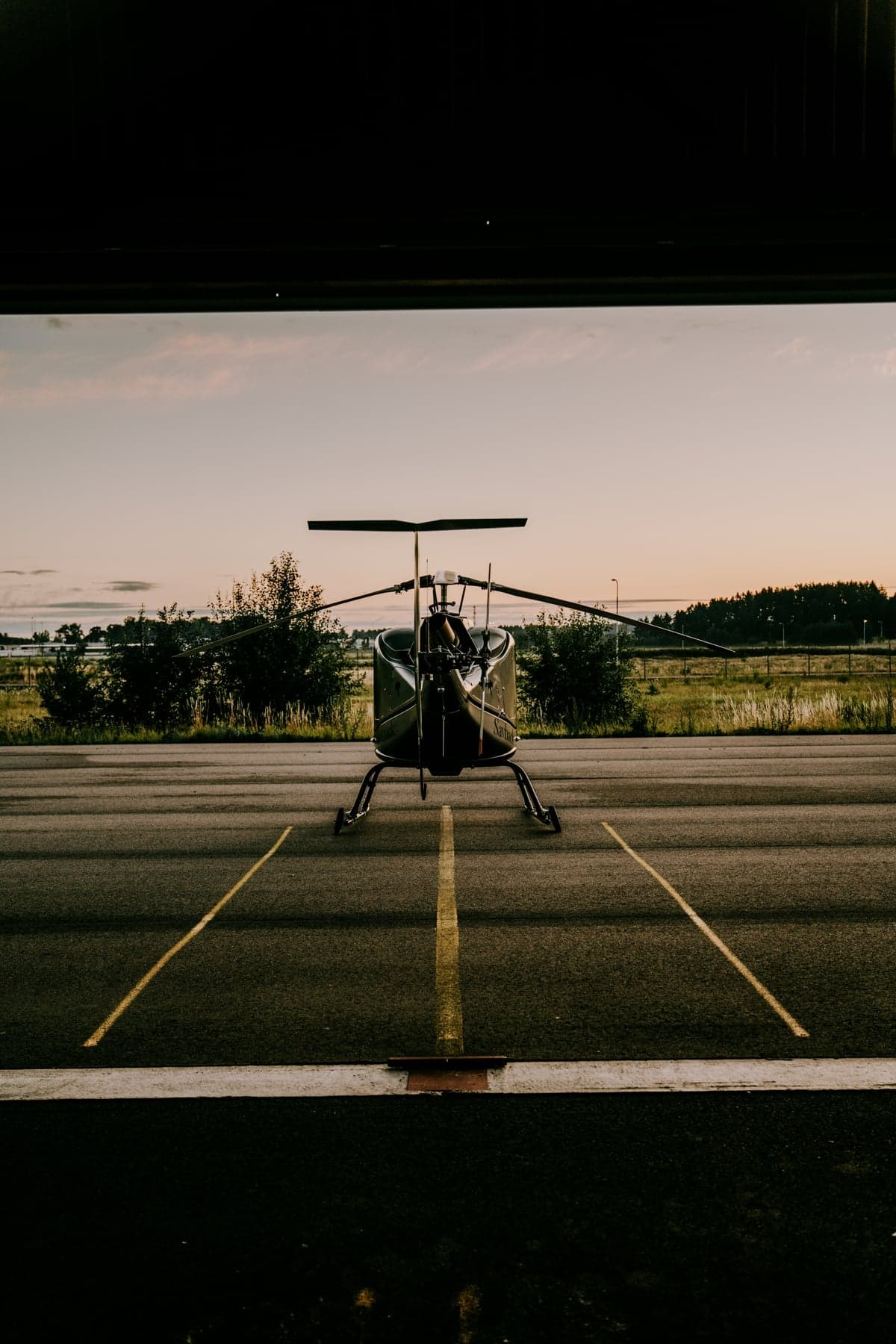 Front view of a helicopter parked on a tarmac.
