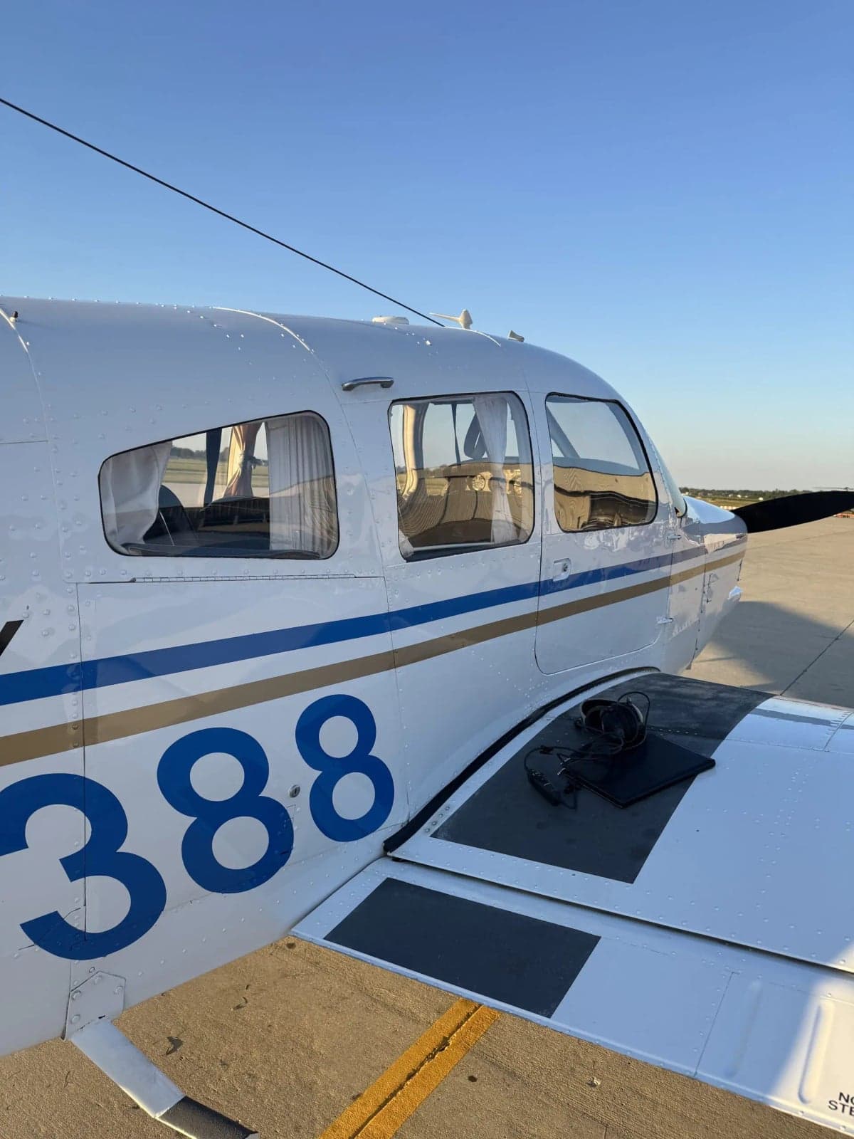 Close up of the side of the Cherokee Arrow N44388 showing the blue and gold paint scheme.