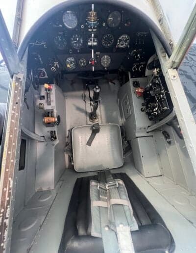 View of the aircraft's cockpit, including the seat and instrument panel.