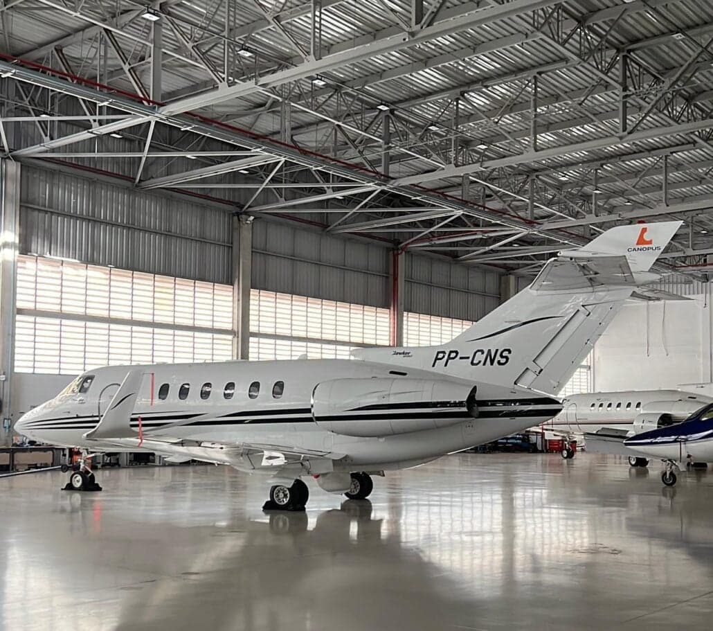 Side view of a Cessna Citation Jet inside a hangar.