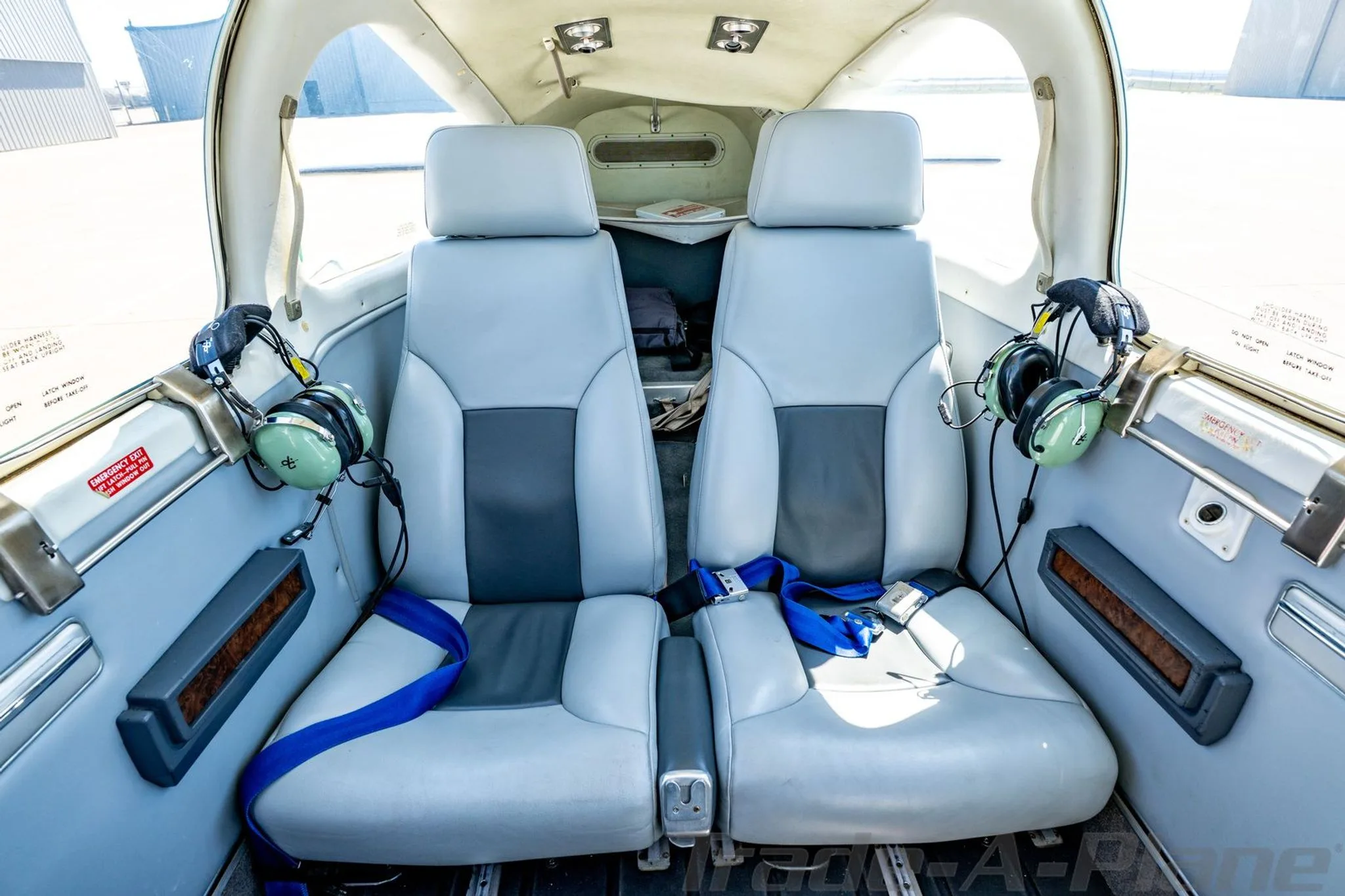 View of the light gray and dark gray passenger seats in the N4UF aircraft cabin.