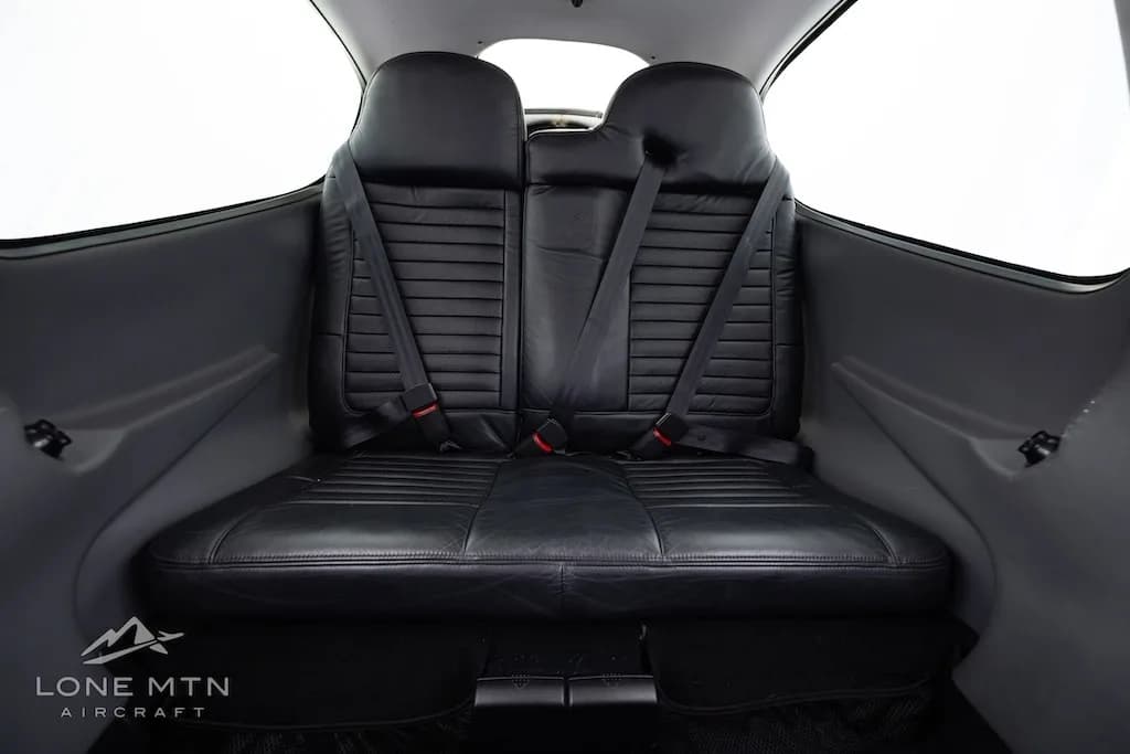 Rear view of the black leather passenger seats in the cabin of the Cirrus SR20.