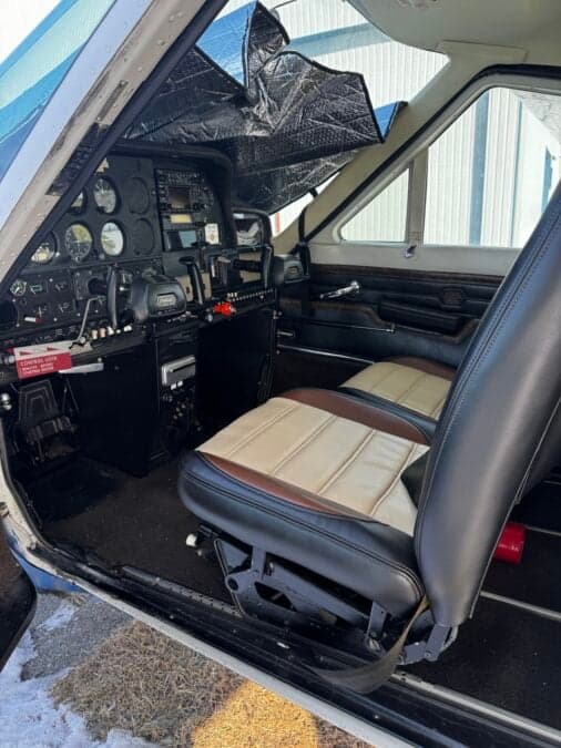 The interior of the Cessna aircraft, showing the cockpit and front seats.
