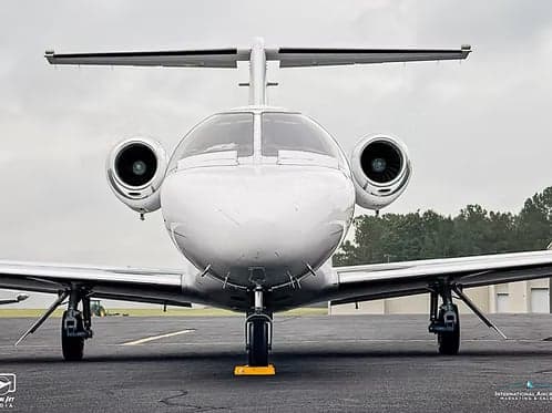 Front view of a Cessna Citation CJ1+ aircraft on the ground.
