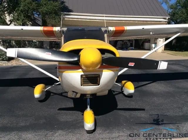 Close-up front view of N8834X Cessna 172 Skyhawk showing the propeller and cowling.