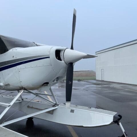 Close-up of the propeller and front of the Cessna floatplane.