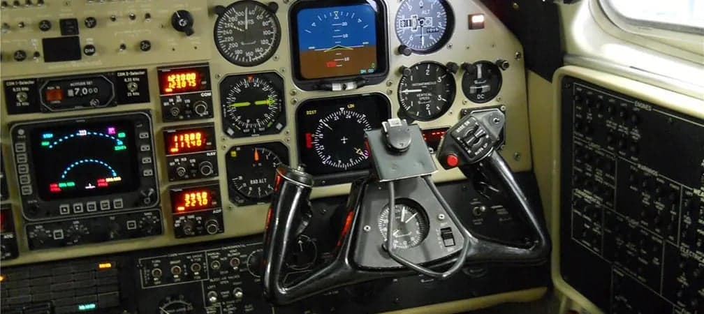 View of the instrument panel in the cockpit of an aircraft.