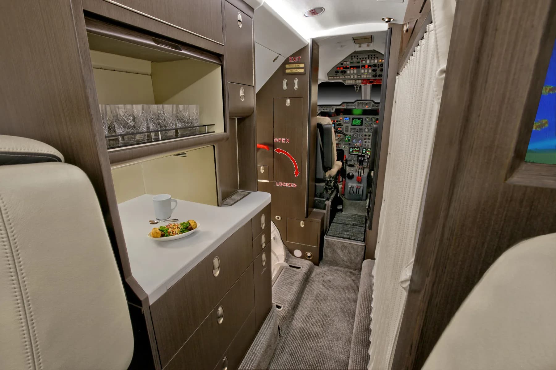 View of the aircraft's interior galley and cockpit.