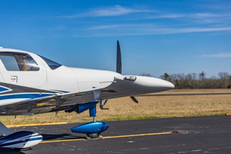 Close up of the wing and propeller of the Cessna TTx, registration N247VB, on the tarmac.