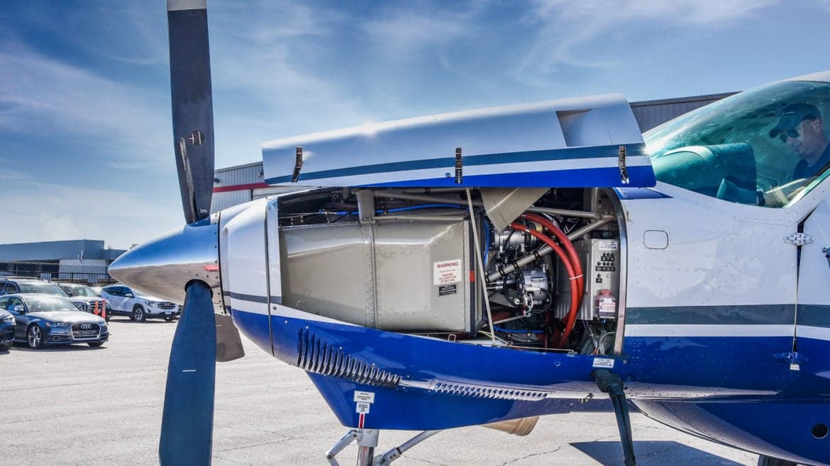 Close up of the engine compartment of a Cessna Caravan with the cowling open.