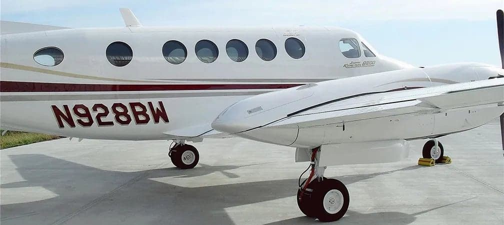 Close-up of the side of a Beechcraft King Air B200 showing the registration number.