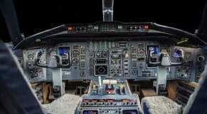 View of the Challenger aircraft cockpit with instrument panel and controls.