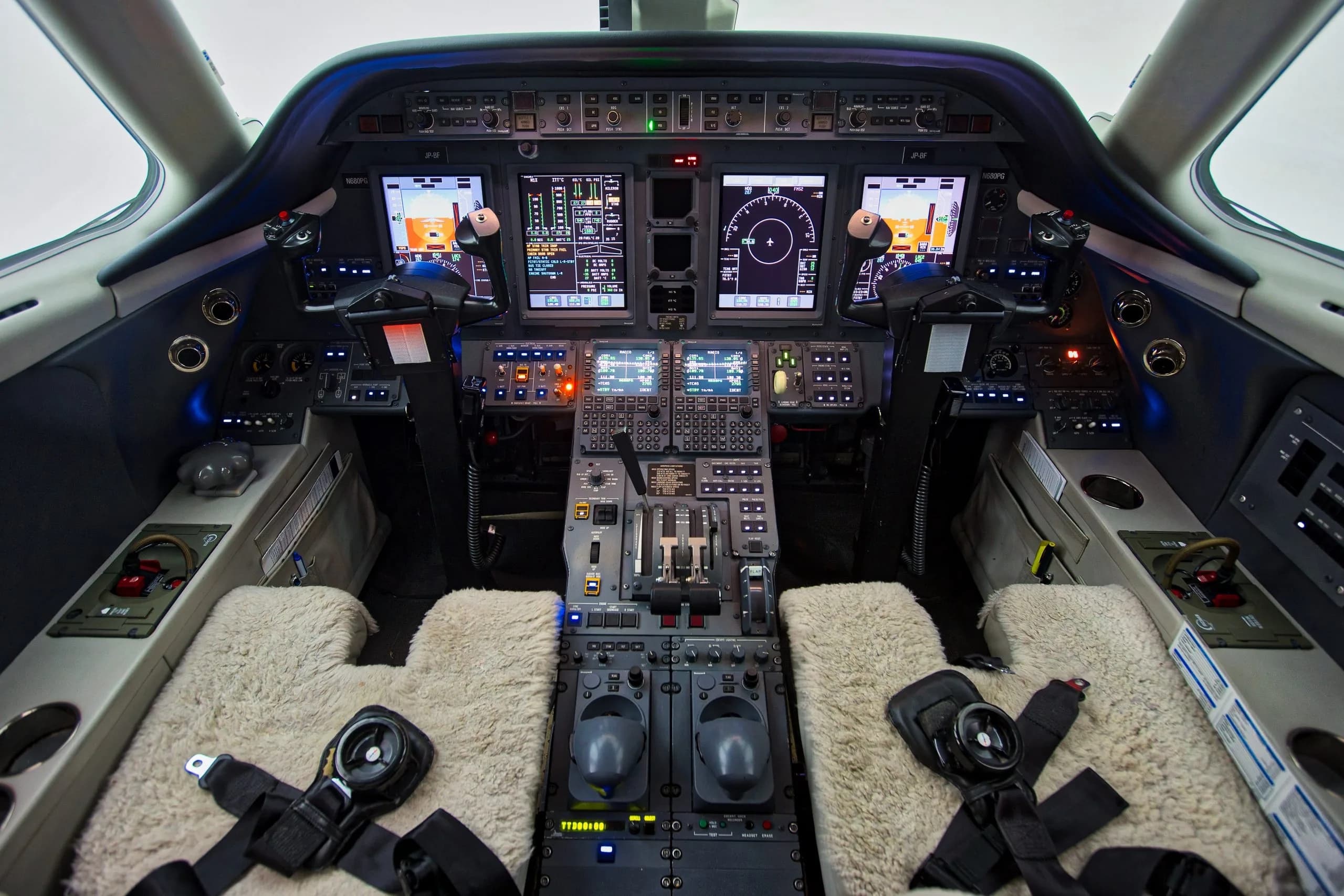 A view of the aircraft cockpit with instrument panel and seats.