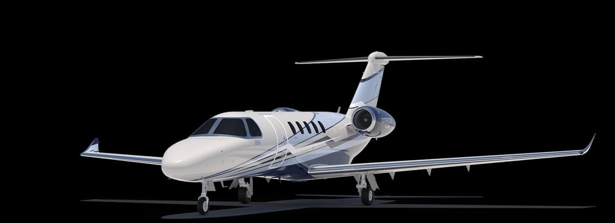 A black and white Citation CJ4 jet on a black background.