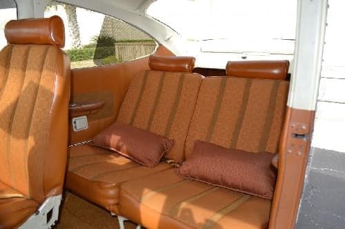 Interior view of the cabin seats in a Cessna 172 Skyhawk aircraft.