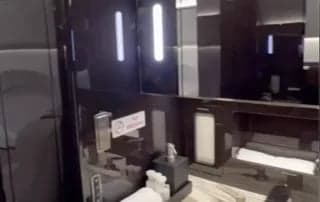 View of the lavatory sink and mirror.