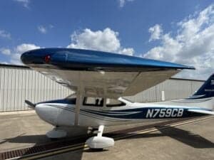 Close-up of the Cessna 172 Skyhawk, registration N759CB, showing the blue and white paint scheme.