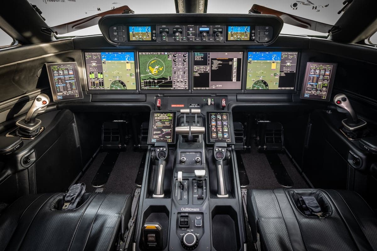 The cockpit of the Gulfstream aircraft features advanced avionics and controls.
