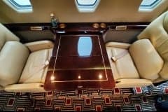 View down the aisle of the cabin of a Cessna Citation CJ3+.