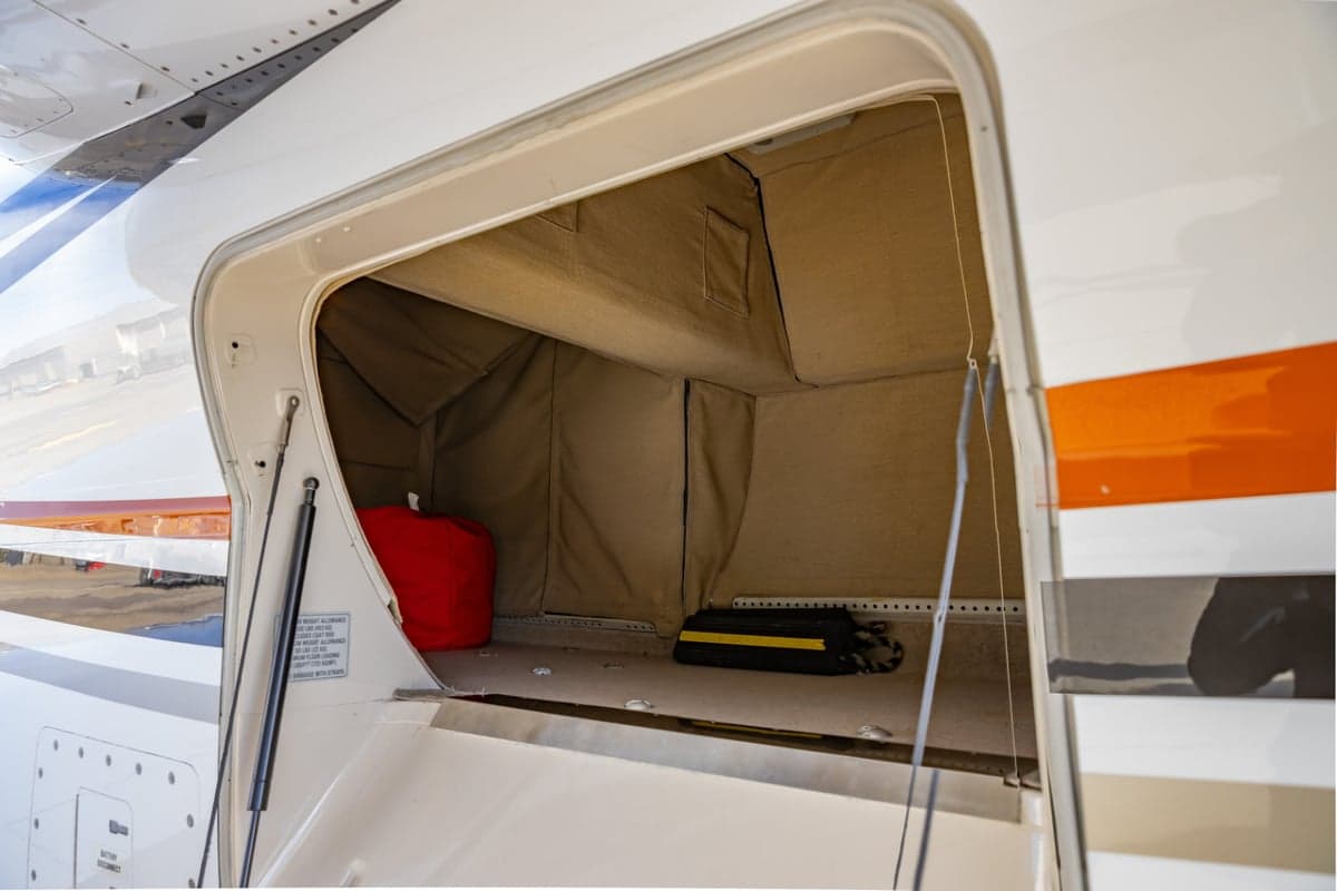 Open baggage compartment of a jet aircraft.