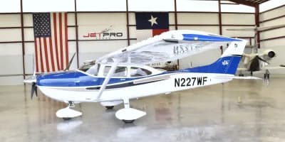 A Cessna 206H Stationair parked in a hangar.