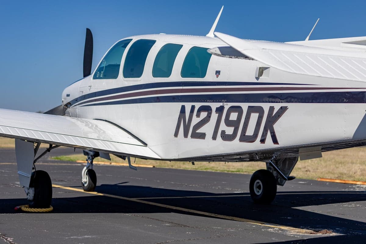 Close up of the side of the Beechcraft Bonanza N219DK showing the tail number.