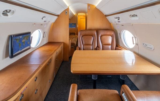 Aircraft cabin interior with leather seats.