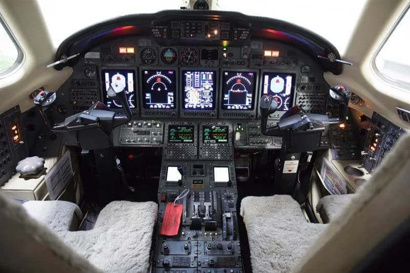 The cockpit features a full array of instruments and controls.
