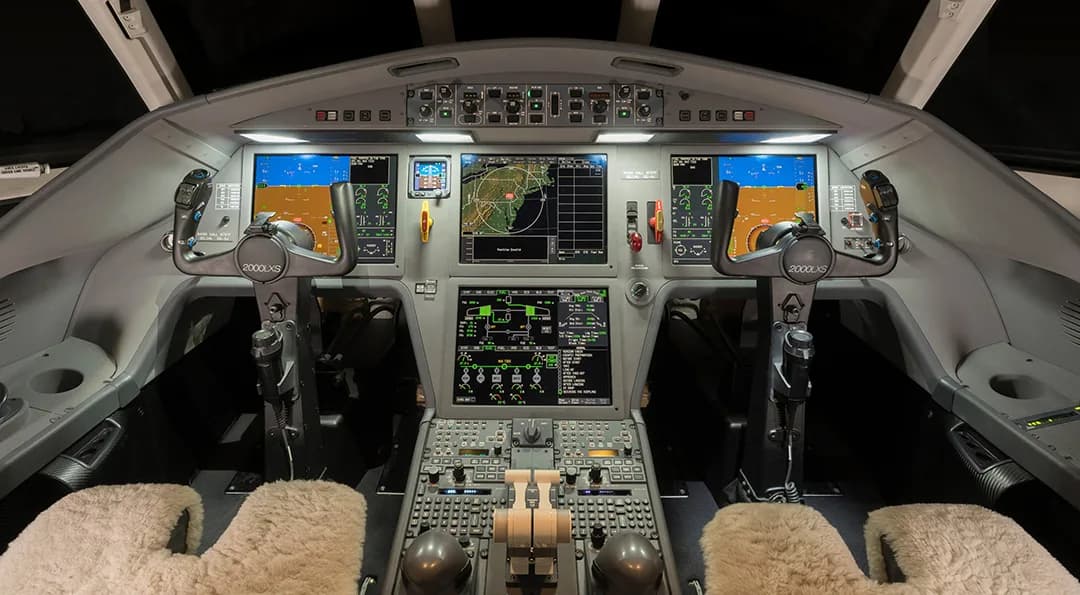 The cockpit of the aircraft features a full instrument panel and dual control sticks.