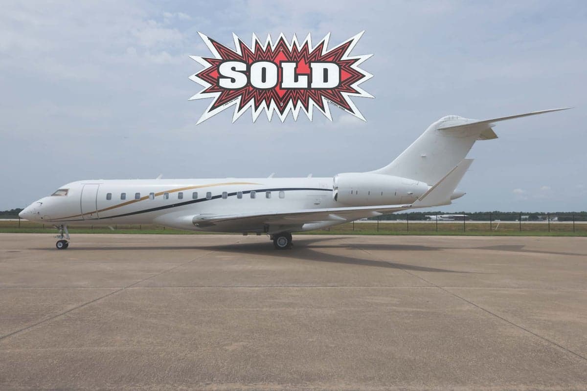 Side view of a white Bombardier Global Express aircraft with a SOLD graphic overlay.