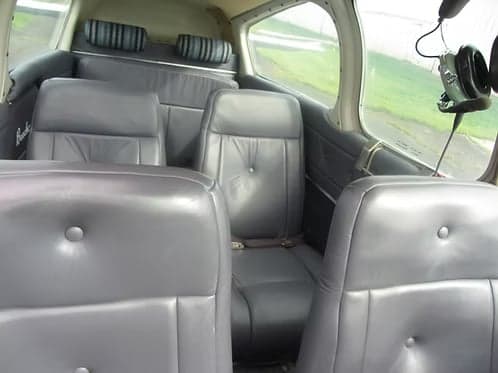Interior view of the cabin seats in a Beechcraft Bonanza.