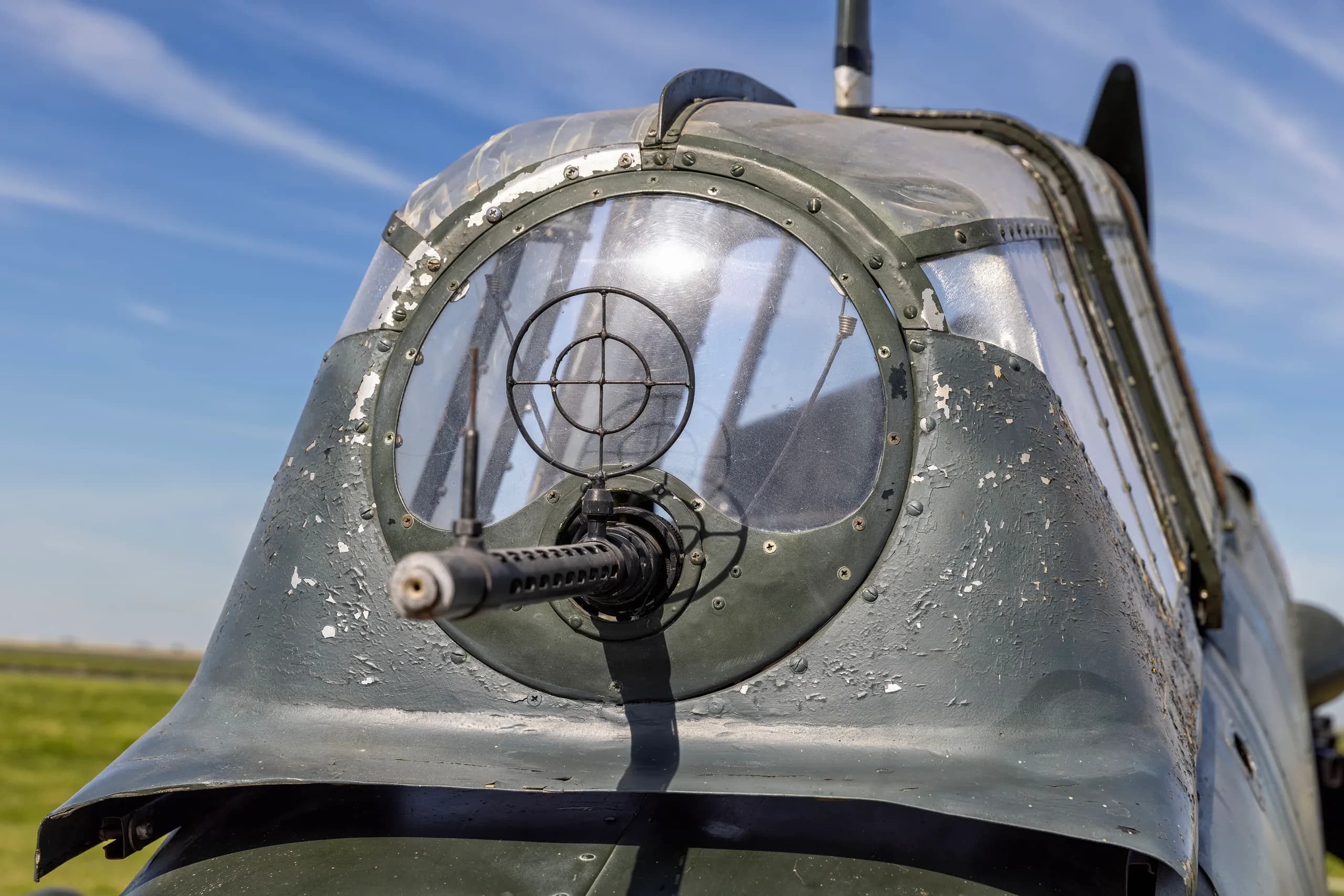 A close-up view of the rear gunner's transparent dome and machine gun on a Junkers Ju 87 Stuka.