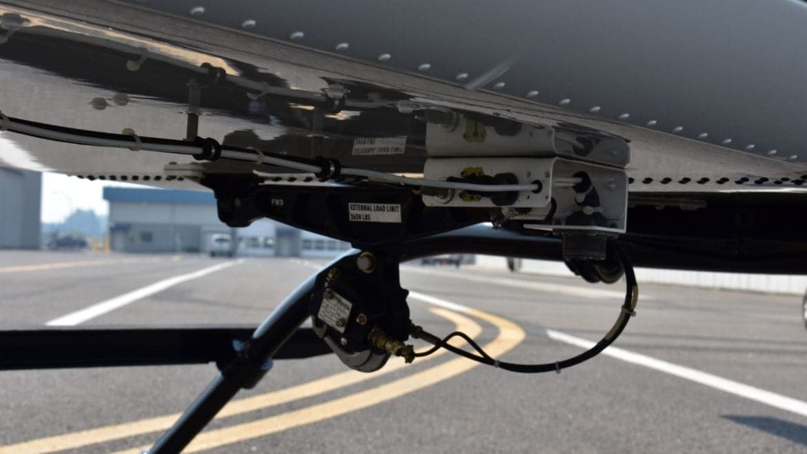 Close-up of the landing gear and underside of a helicopter.