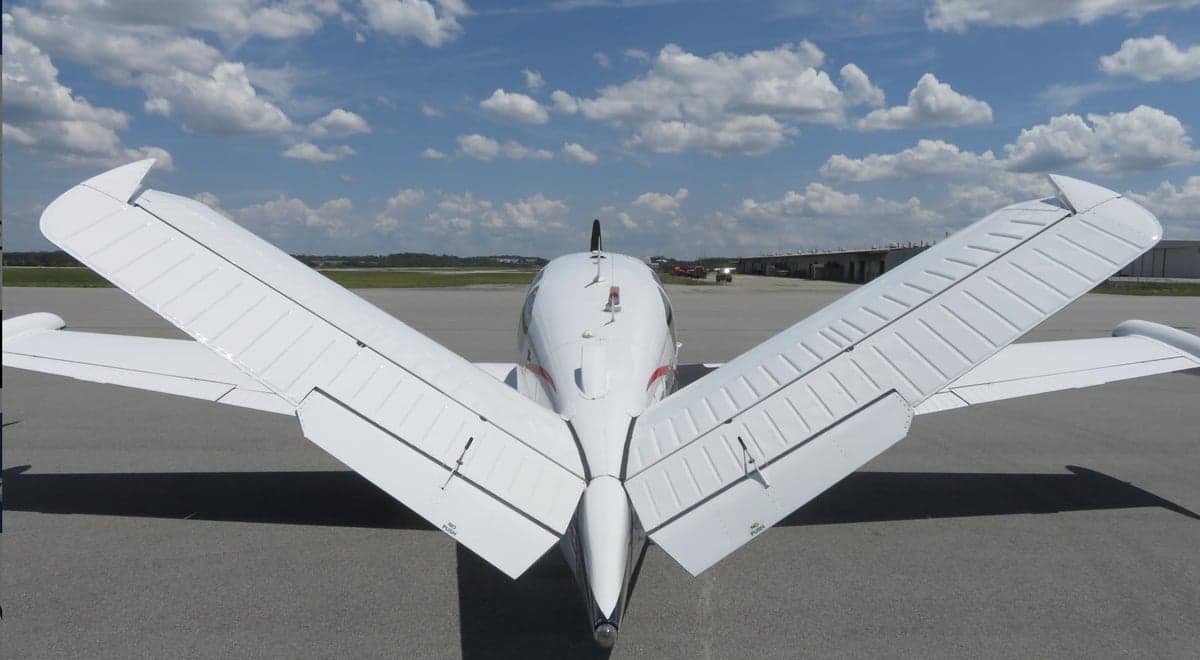 Rear view of the Beechcraft Bonanza N428TL showing the tail section.