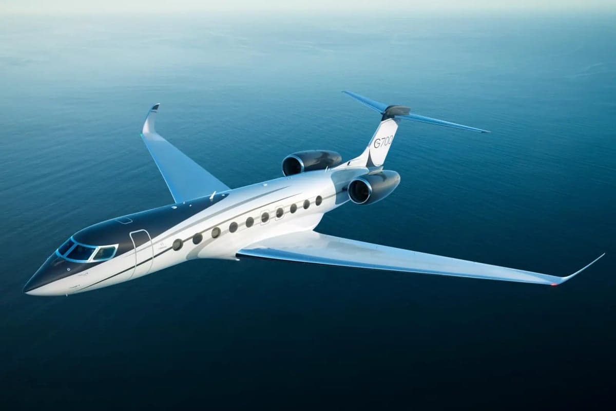 A Gulfstream G700 in flight over the ocean.