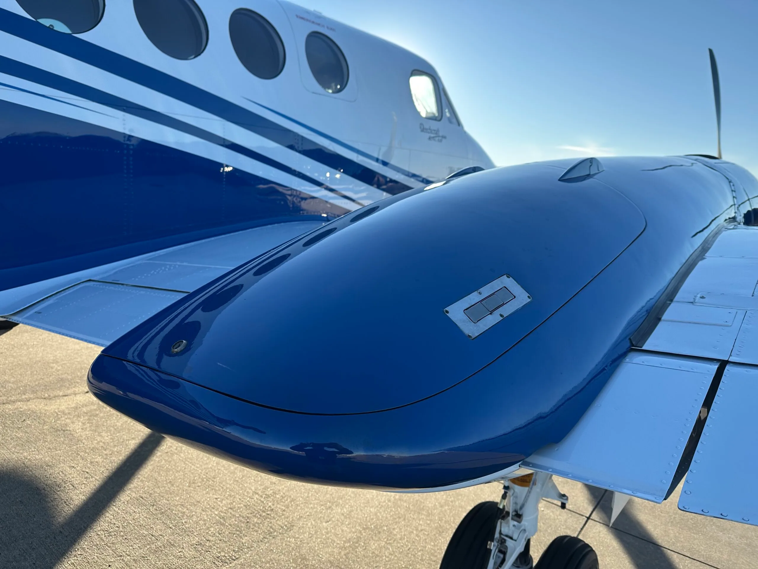Close up of the wing and fuselage of a Beechcraft King Air 360ER.