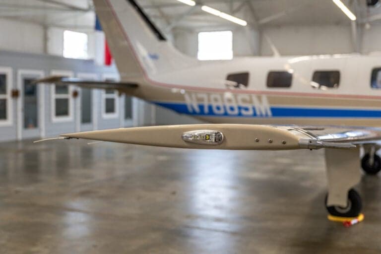 A close-up of the wingtip and N788SM tail number of the Malibu aircraft.