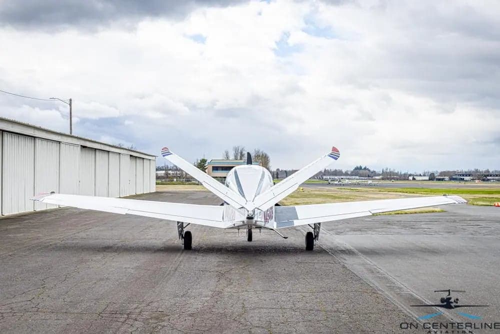 Rear view of the Beechcraft Bonanza N454RB on the tarmac.